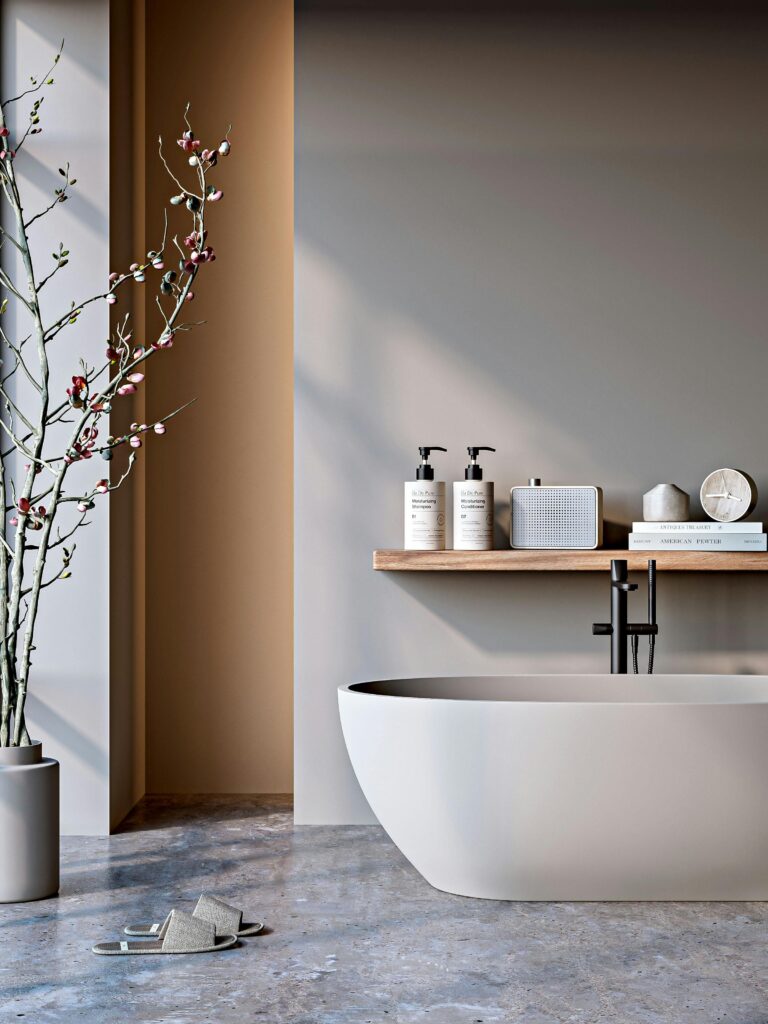 Elegant bathtub with modern decor and matte finish against neutral tones in a minimalist bathroom.