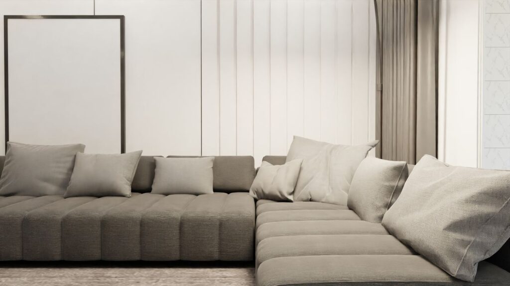 Elegant Scandinavian living room featuring a minimalist design with a stylish, gray sectional sofa and plush cushions.
