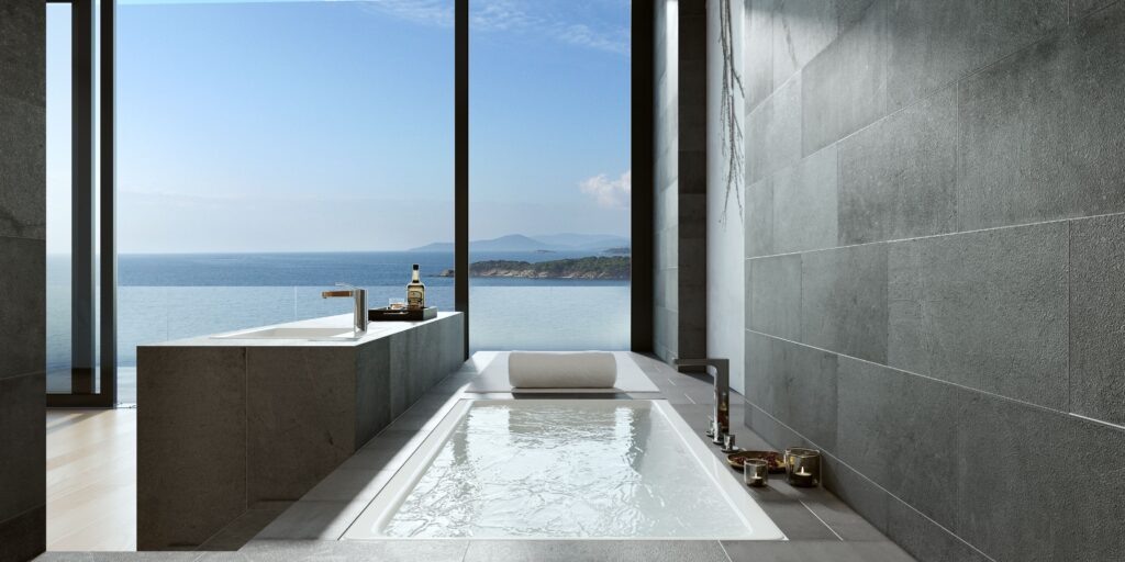 Luxurious minimalist bathroom with ocean view through large windows in Bodrum, Turkey, ideal for relaxation and design inspiration. Bagno di lusso.