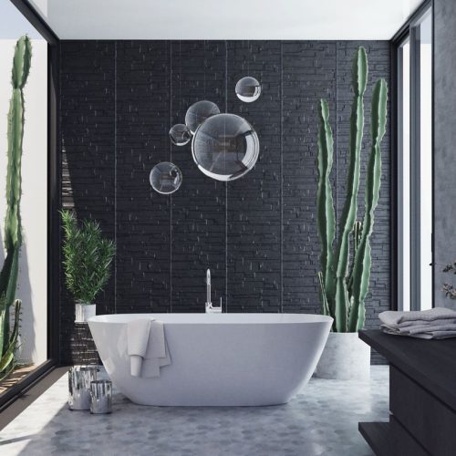 Elegant contemporary bathroom featuring a bathtub, cactus plants, and bubble wall art.