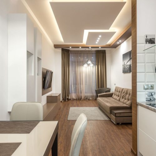 Elegant modern apartment interior with minimalist decor and cozy ambiance. controsoffitto in cartongesso.
